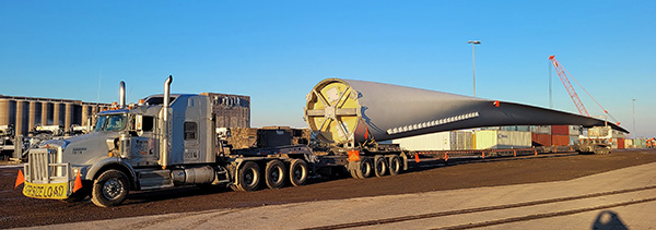 Photo: Wind blade on the back of a semi truck.